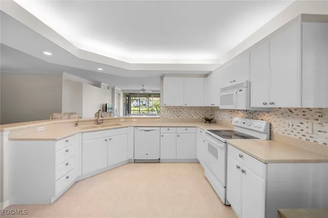 a view of a room with furniture and wooden floor