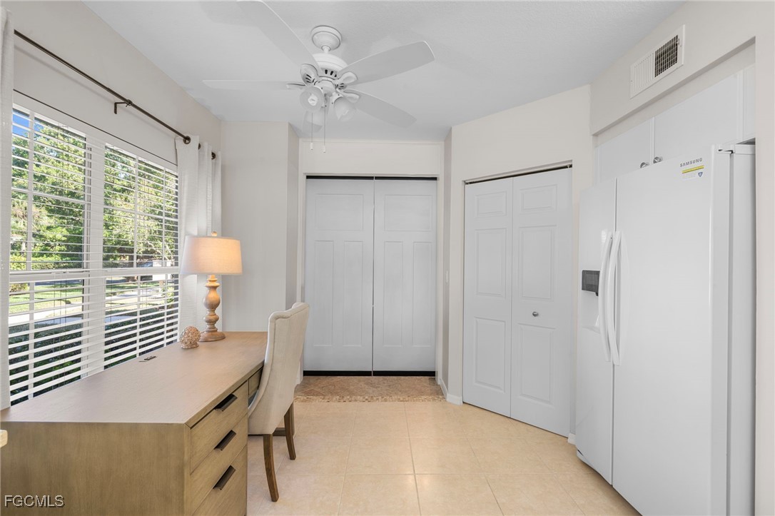 10831 Halfmoon Shoal Road, Unit 104 Estero, FL 34135 - Photo 19 of 49 a view of a room with furniture and wooden floor