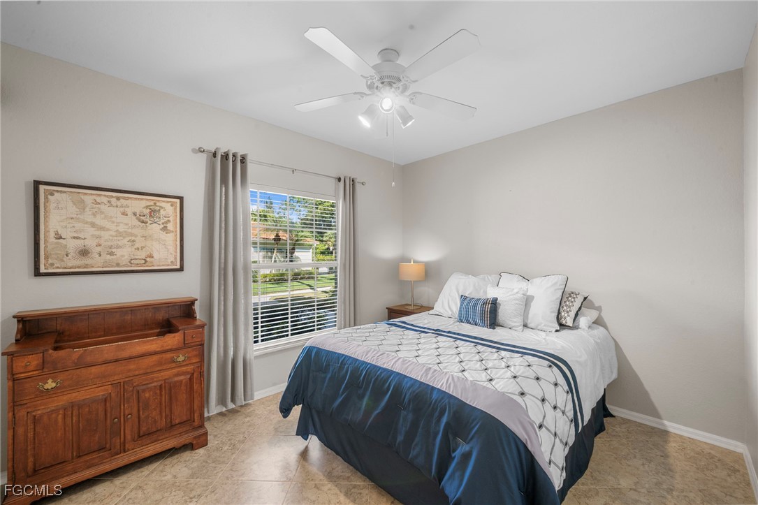 10831 Halfmoon Shoal Road, Unit 104 Estero, FL 34135 - Photo 26 of 49 a bedroom with a bed and a window