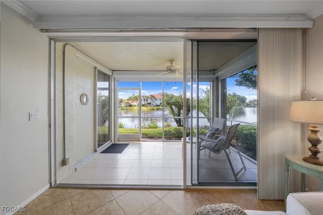 a view of a dining room with furniture large windows and wooden floor