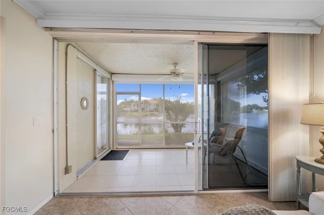 a view of a door and chair in the patio and yard