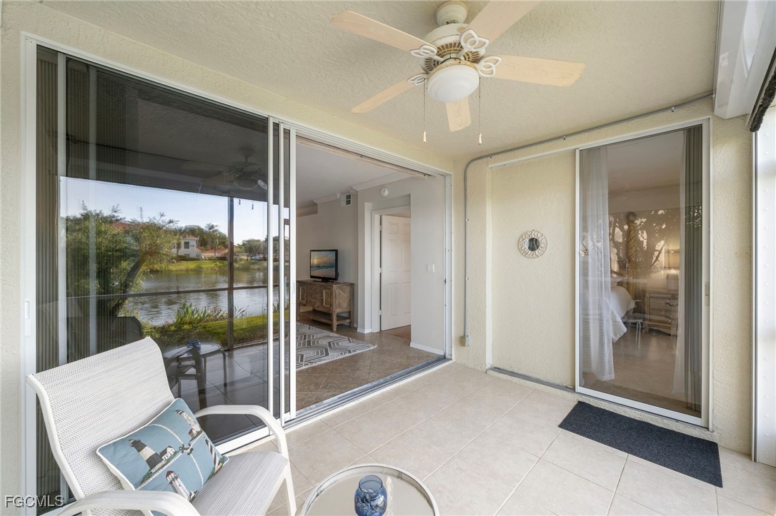 10831 Halfmoon Shoal Road, Unit 104 Estero, FL 34135 - Photo 33 of 49 a living room with a large window and a glass door shower