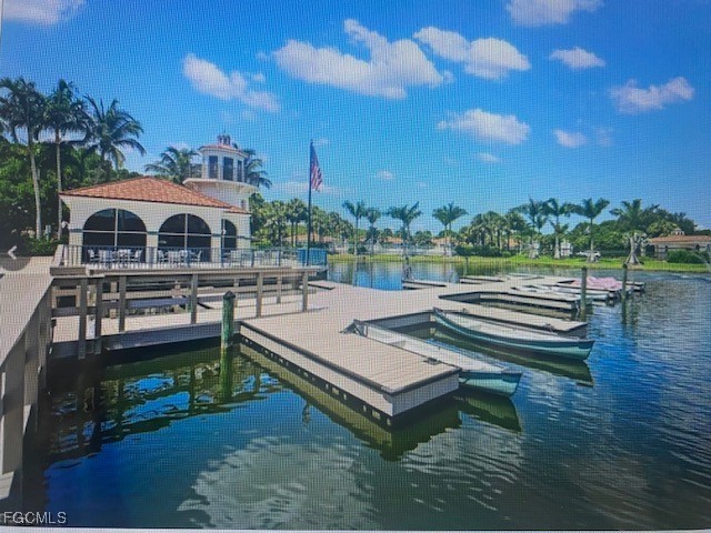 10831 Halfmoon Shoal Road, Unit 104 Estero, FL 34135 - Photo 45 of 49 a view of a roof deck with couches and wooden floor