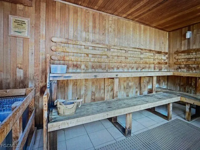 a building outdoor space with patio furniture and potted plants