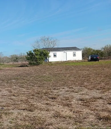 a view of ocean with a yard