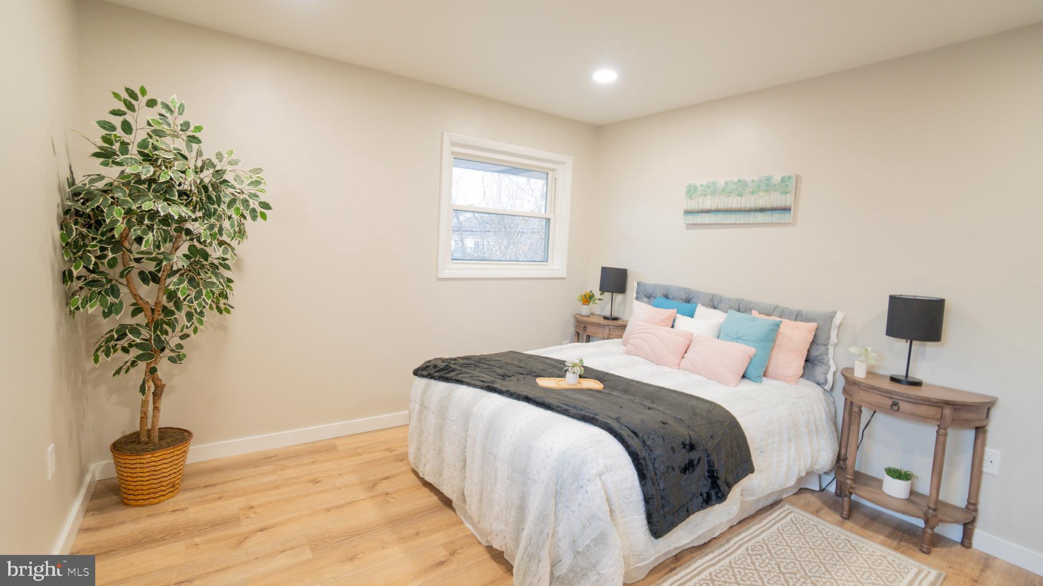 3420 Belair Road Harrisburg, PA 17109 - Photo 13 of 34 a bedroom with a bed and a potted plant