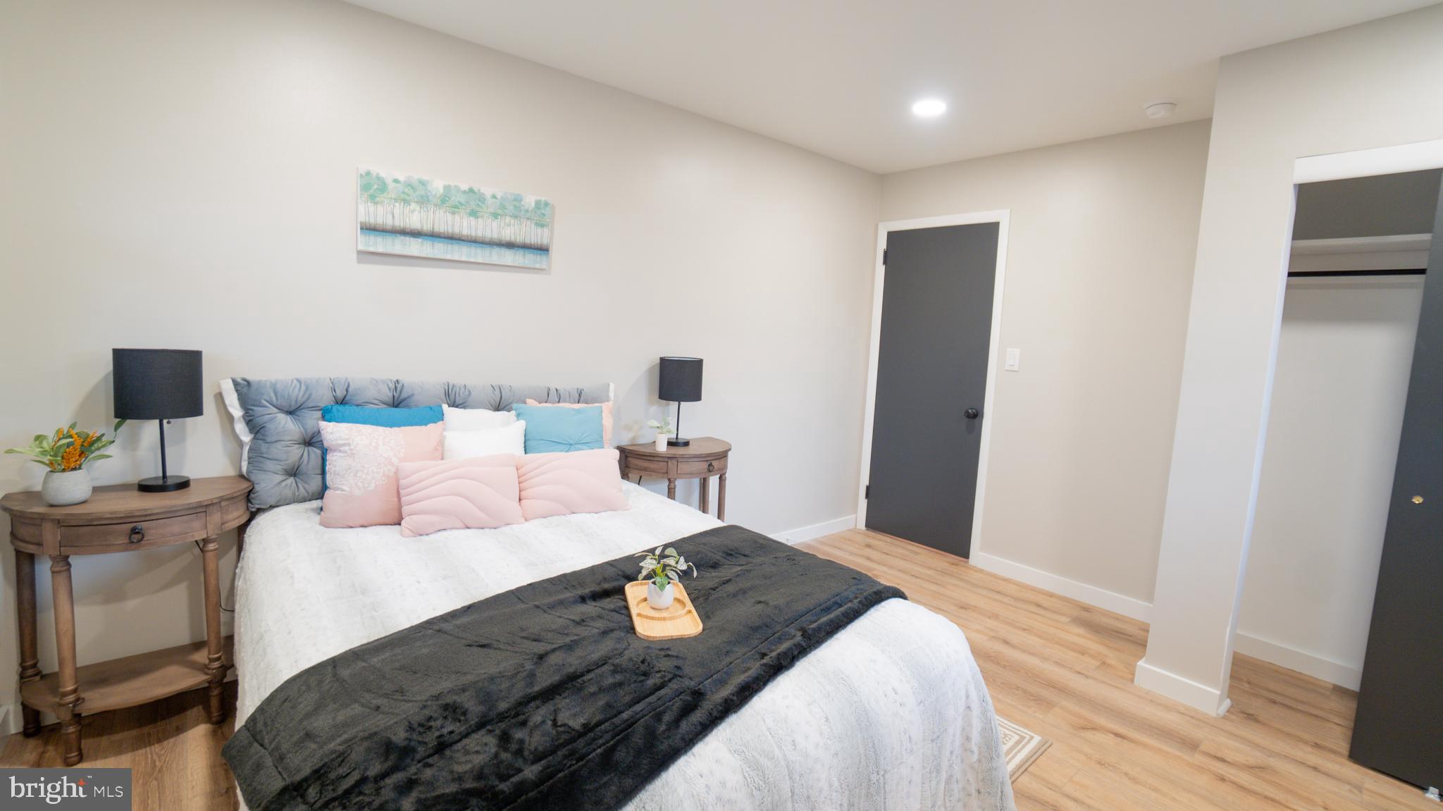 3420 Belair Road Harrisburg, PA 17109 - Photo 14 of 34 a bedroom with a bed and wooden floor