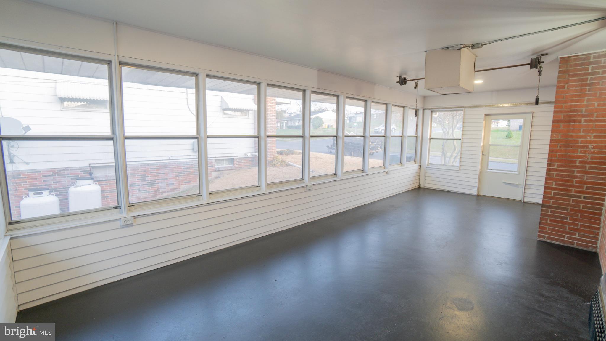 3420 Belair Road Harrisburg, PA 17109 - Photo 17 of 34 an empty room with wooden floor and windows