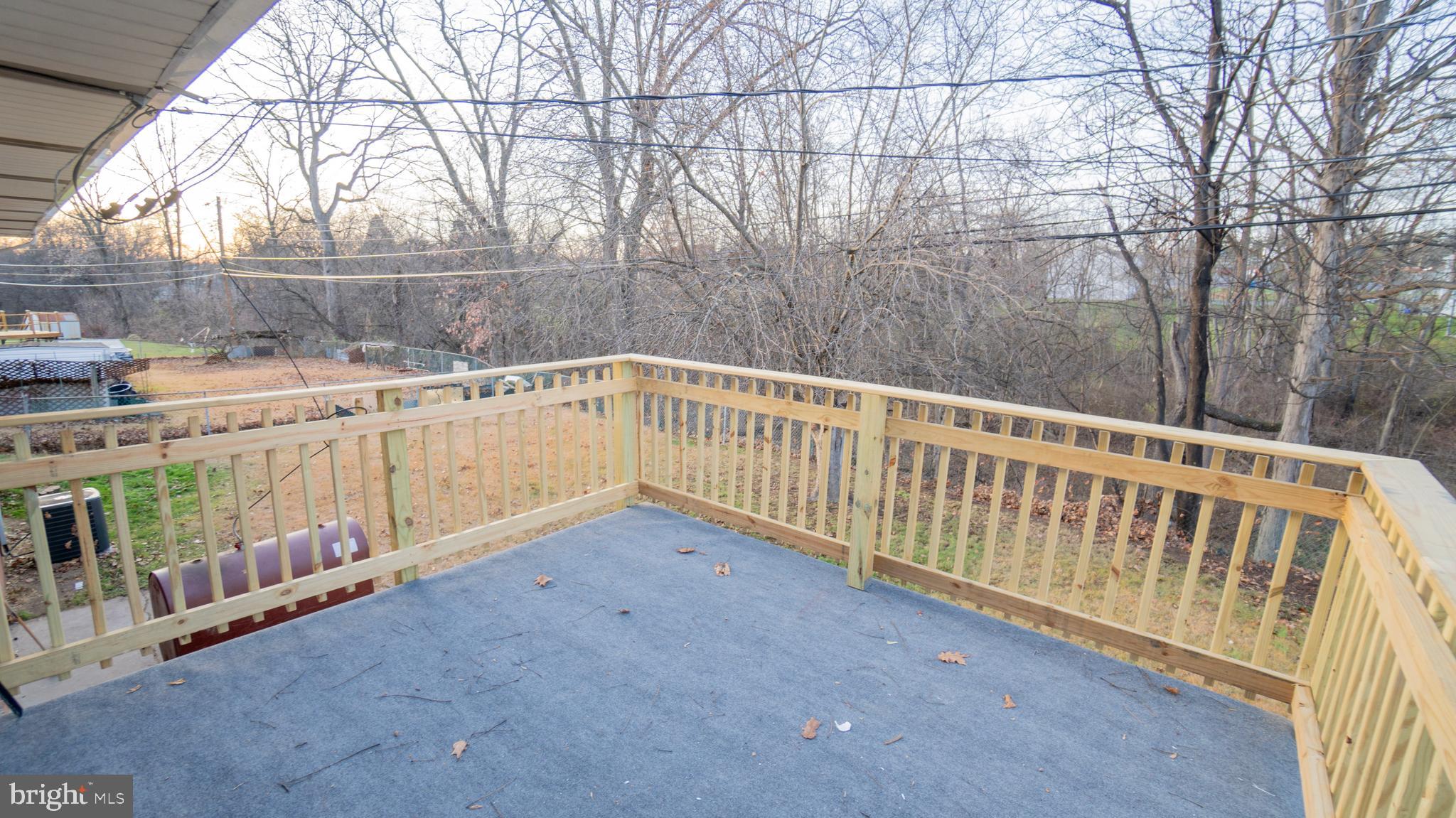 3420 Belair Road Harrisburg, PA 17109 - Photo 20 of 34 a view of a balcony with wooden floor and fence