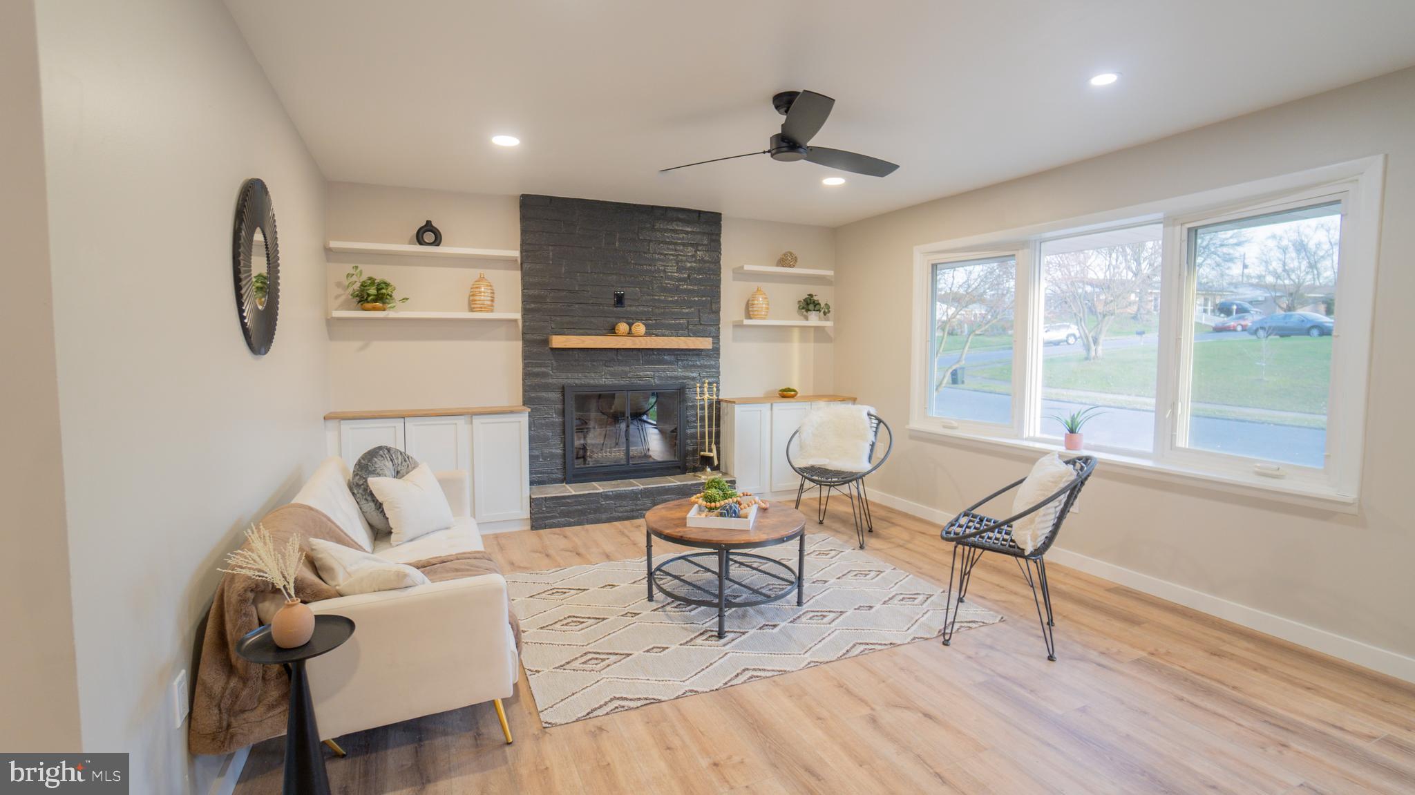 3420 Belair Road Harrisburg, PA 17109 - Photo 2 of 34 a living room with furniture and a fireplace