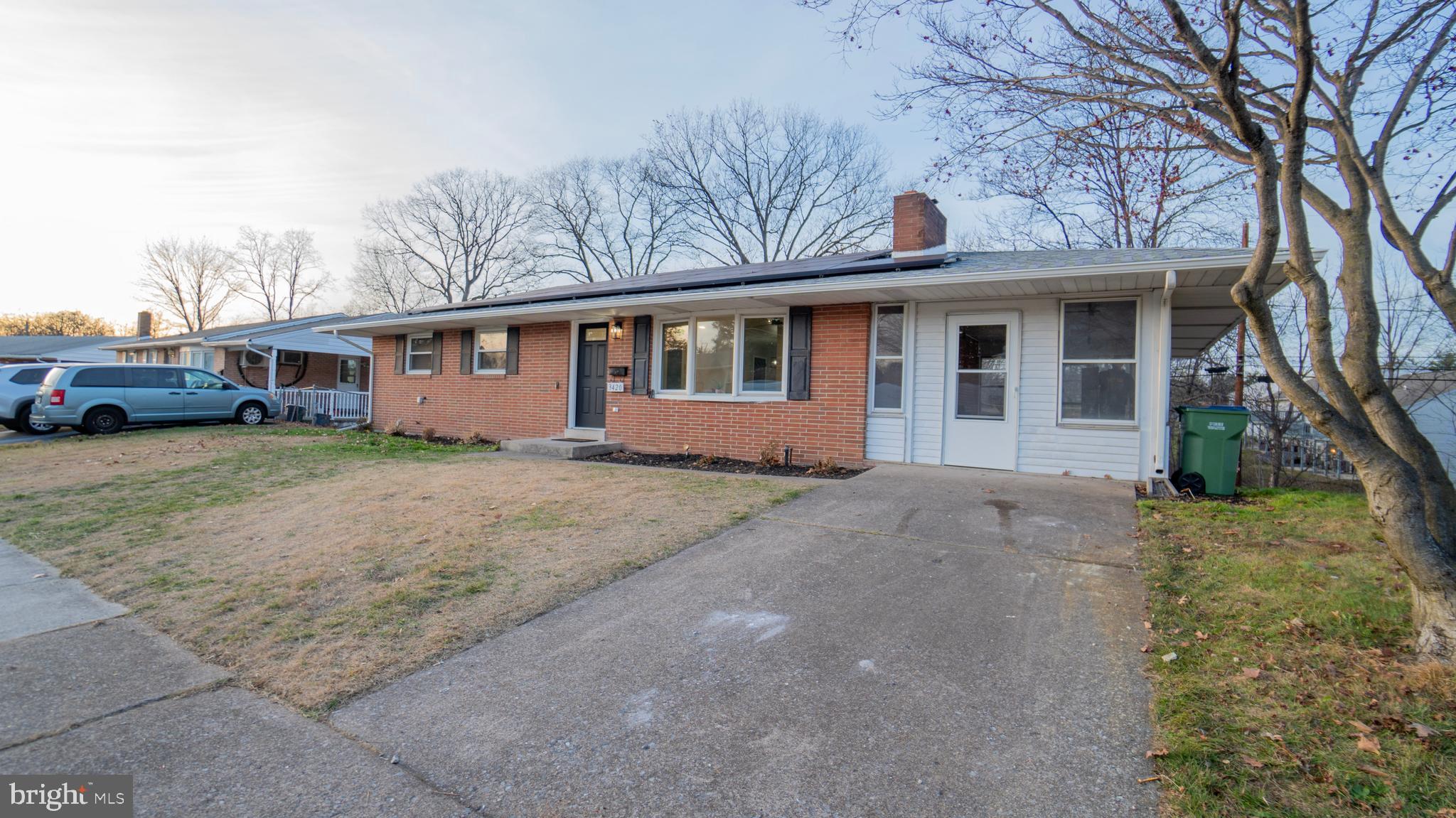 3420 Belair Road Harrisburg, PA 17109 - Photo 31 of 34 a front view of a house with a yard and garage