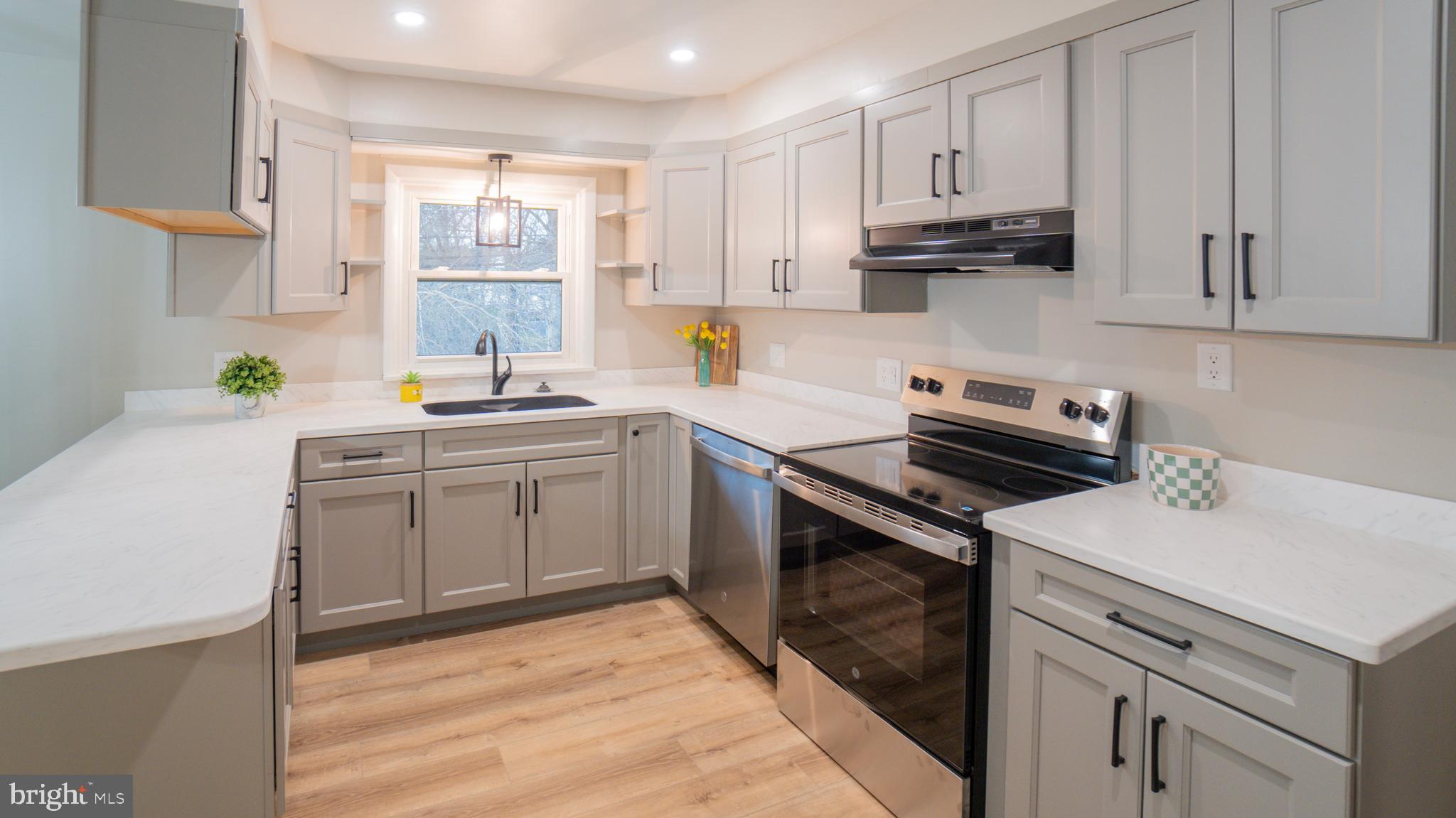3420 Belair Road Harrisburg, PA 17109 - Photo 5 of 34 a kitchen with a sink stove and cabinets