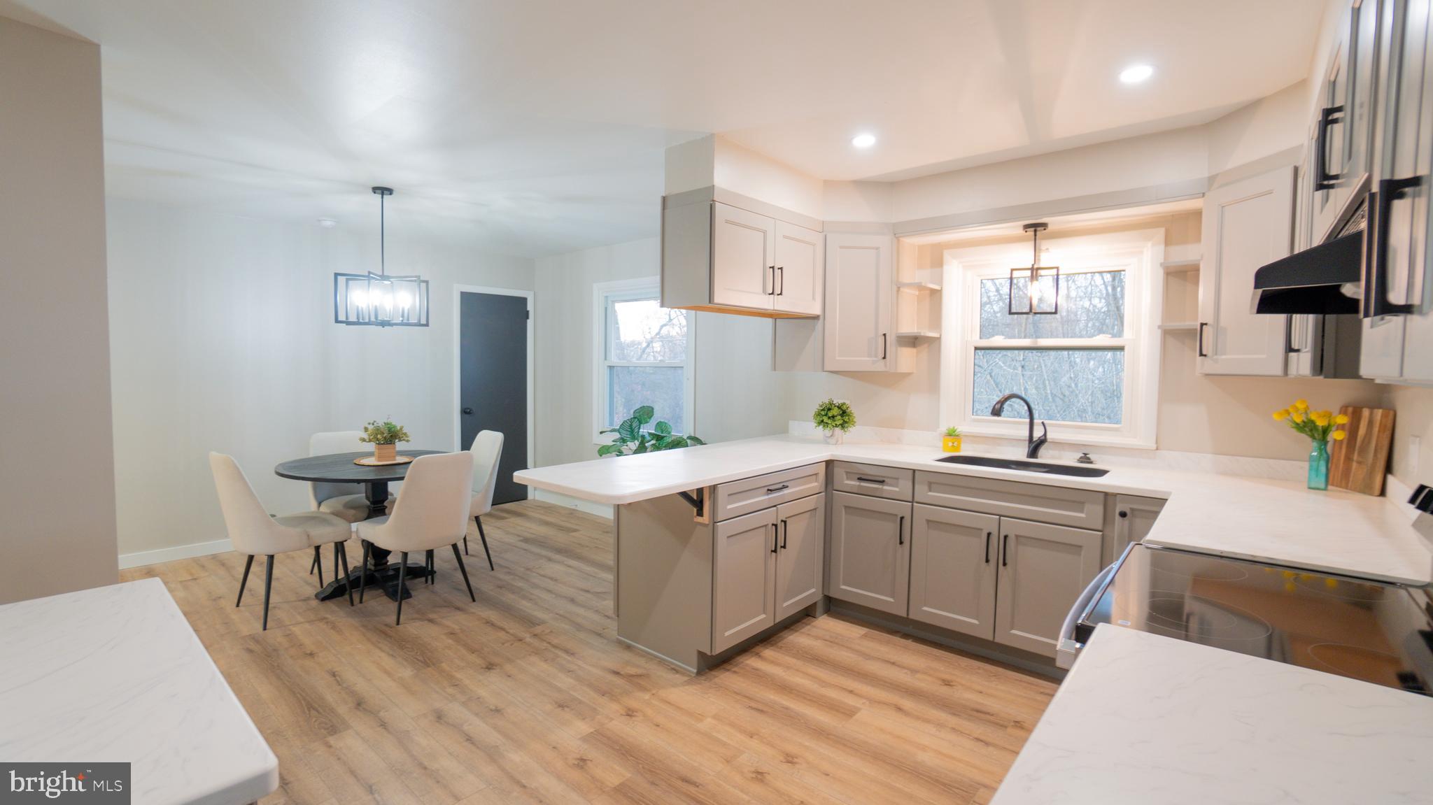 3420 Belair Road Harrisburg, PA 17109 - Photo 6 of 34 a kitchen that has a lot of white cabinets and wooden floor