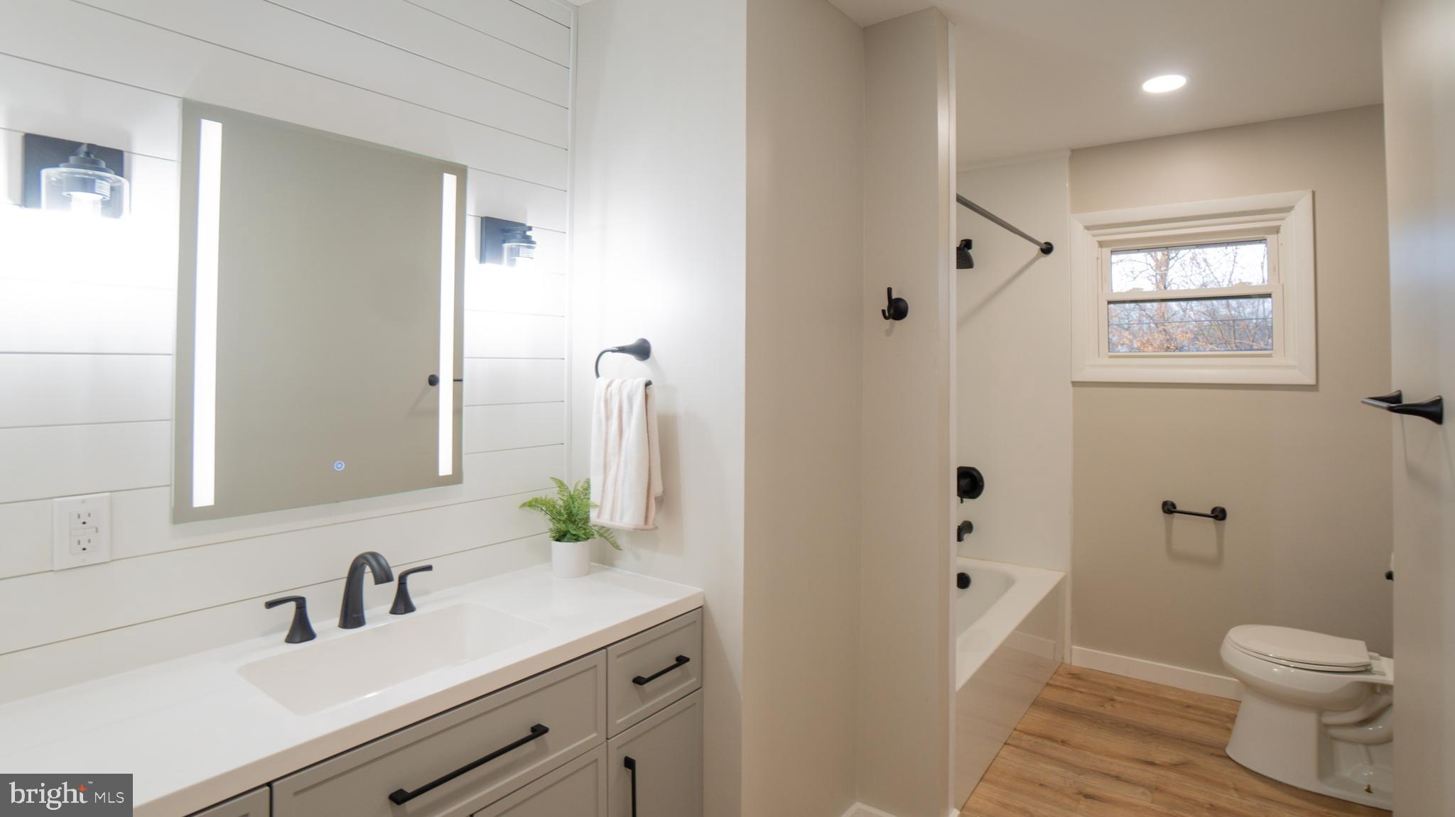 3420 Belair Road Harrisburg, PA 17109 - Photo 8 of 34 a bathroom with a granite countertop sink toilet and shower