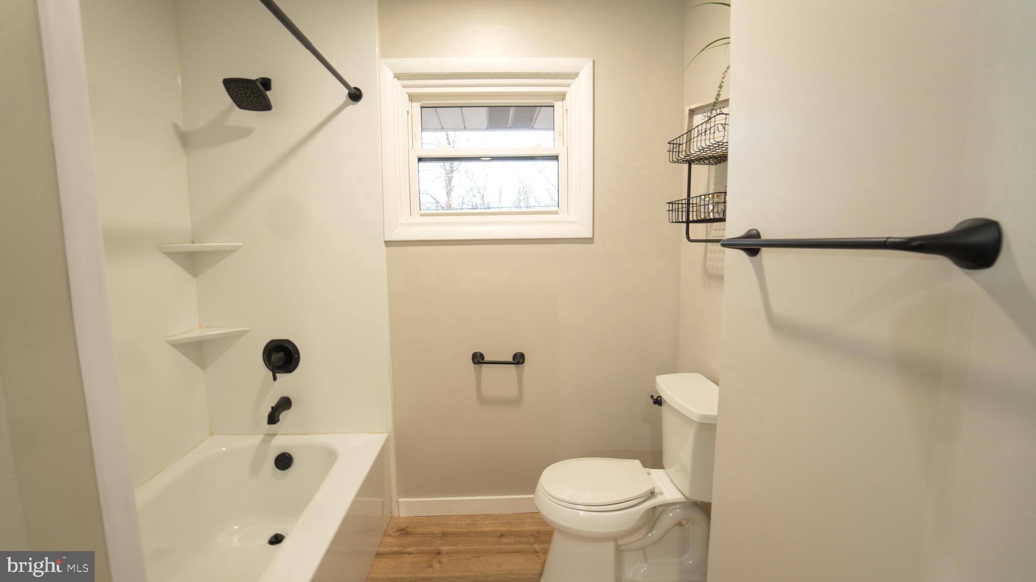 3420 Belair Road Harrisburg, PA 17109 - Photo 9 of 34 a bathroom with a bathtub and a shower
