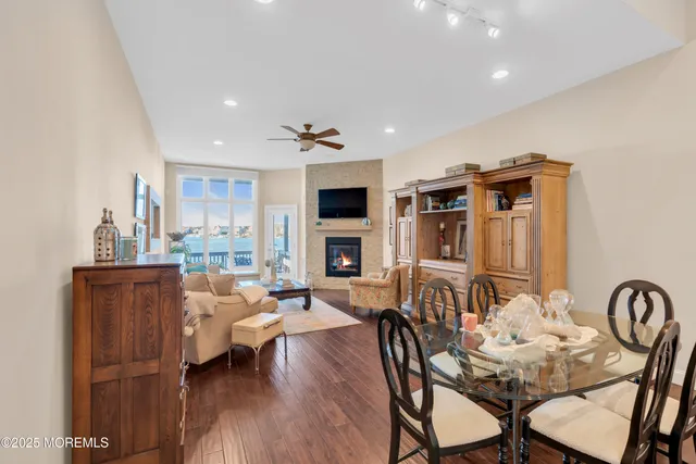 a living room with fireplace furniture and a wooden floor