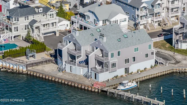 a front view of a residential apartment building with a yard