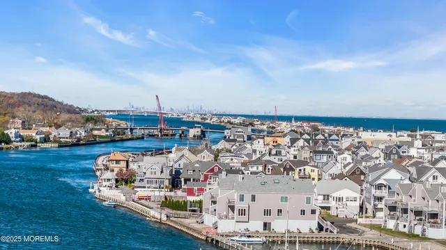 a view of multiple houses with a street