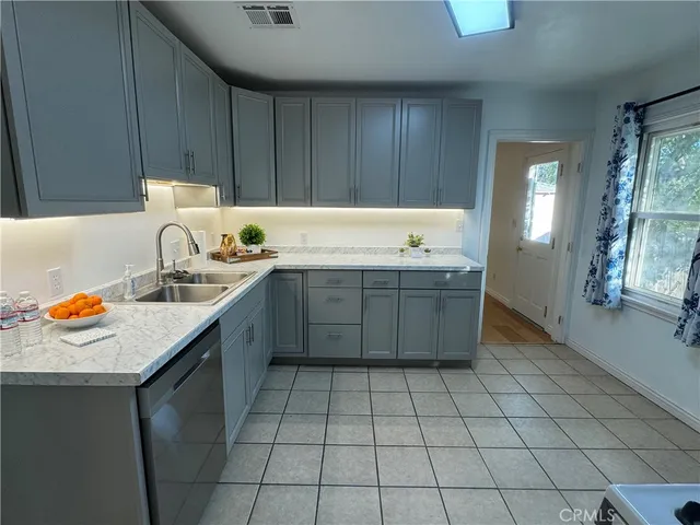 a kitchen with a sink and cabinets