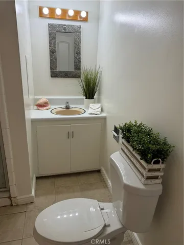 a living room with a sink and a mirror