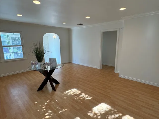 a view of a room with gym equipment and windows