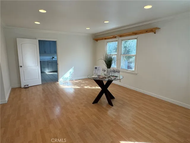 a workspace room with furniture and windows