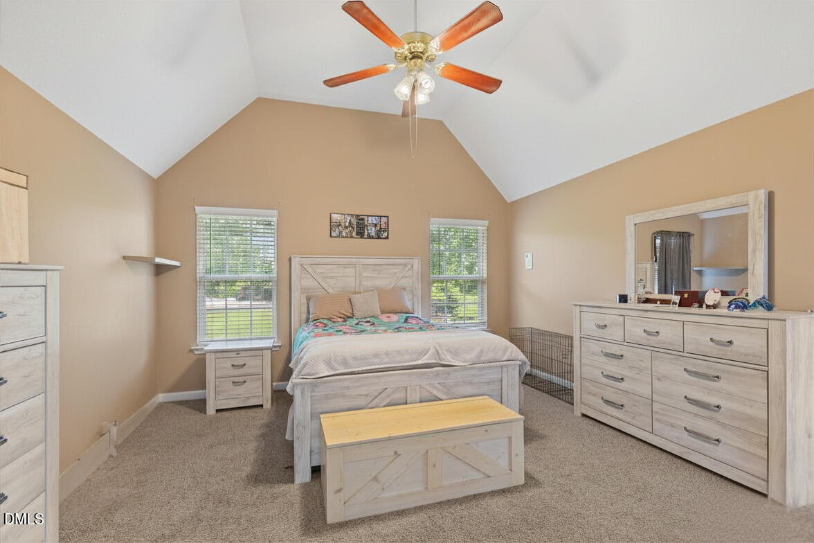 724 Iris Bryant Road Dunn, NC 28334 - Photo 4 of 22 a bedroom with a bed and a dresser