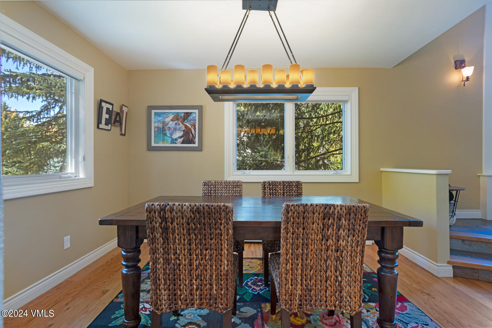 18 Beaver Road, Unit 1 Avon, CO 81620 - Photo 15 of 46 a view of a dining room with furniture and chandelier