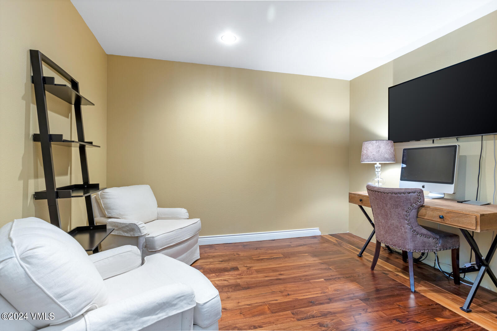 18 Beaver Road, Unit 1 Avon, CO 81620 - Photo 17 of 46 a work room with furniture wooden floor and a flat screen tv