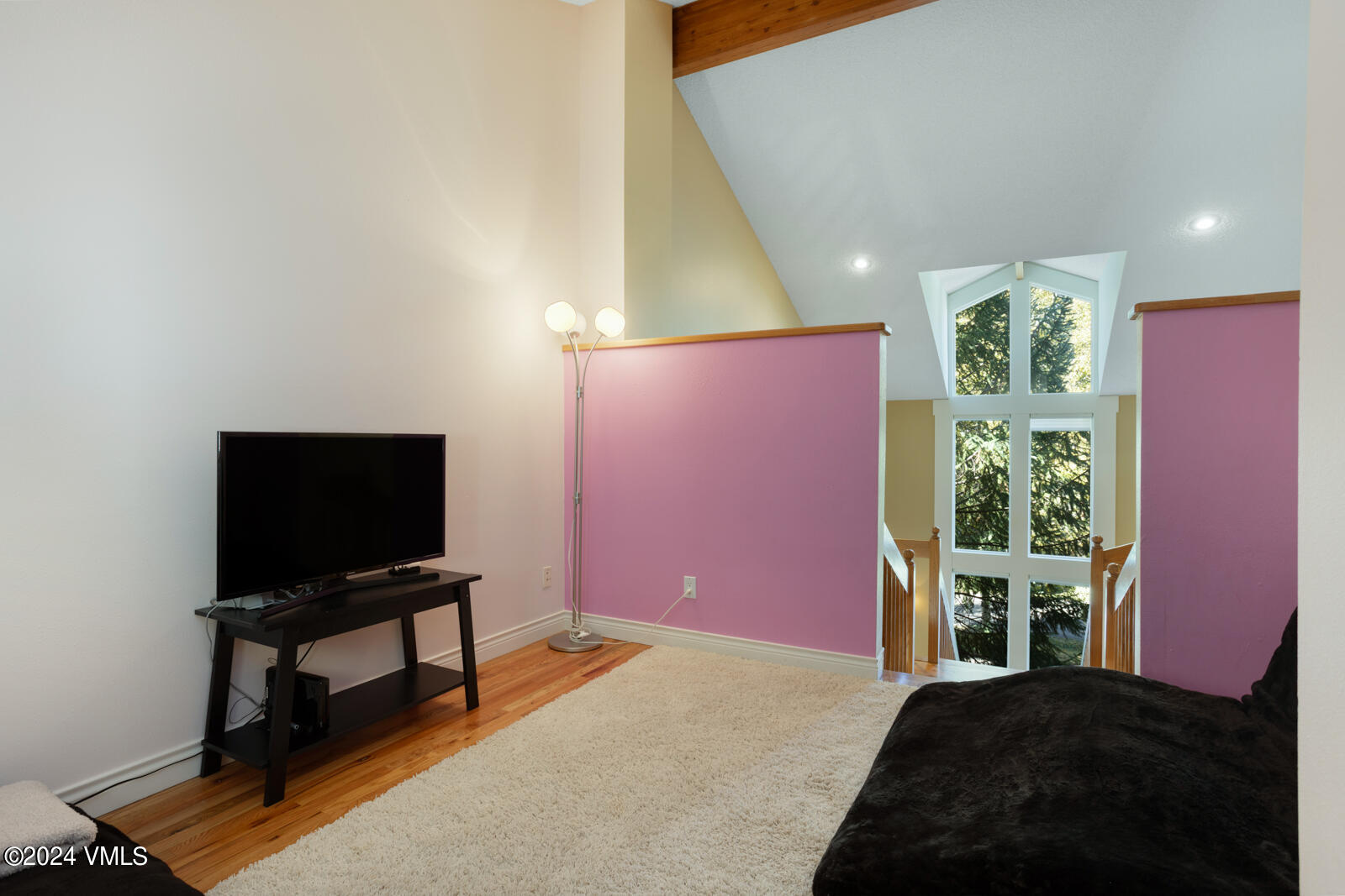 18 Beaver Road, Unit 1 Avon, CO 81620 - Photo 31 of 46 a bedroom with a bed and a flat screen tv