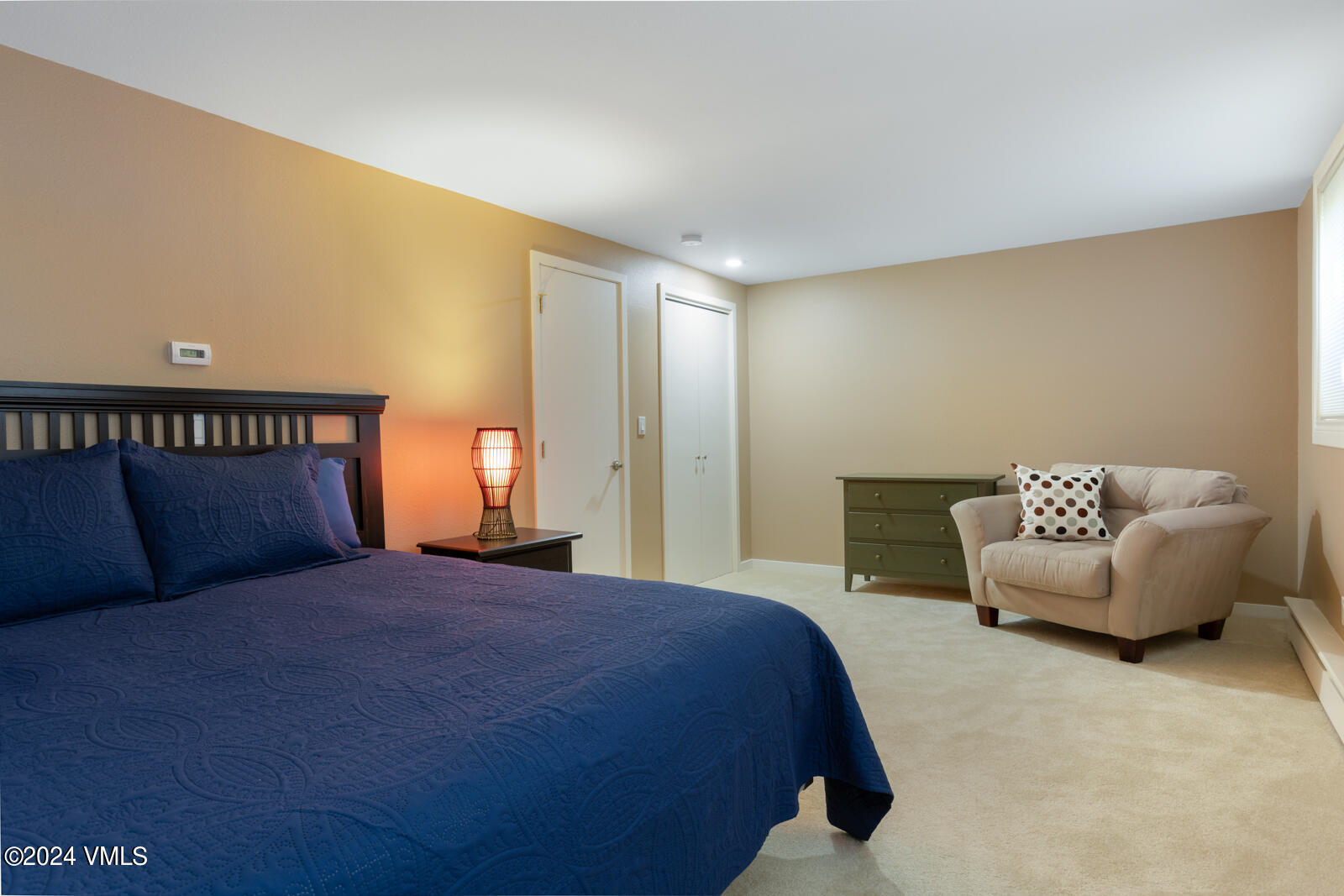 18 Beaver Road, Unit 1 Avon, CO 81620 - Photo 37 of 46 a bedroom with a bed and a couch