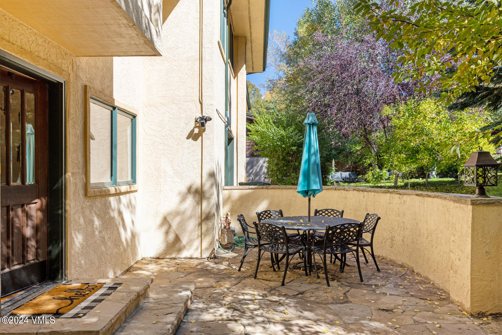 18 Beaver Road, Unit 1 Avon, CO 81620 - Photo 10 of 46 a view of a patio with table and chairs and potted plants
