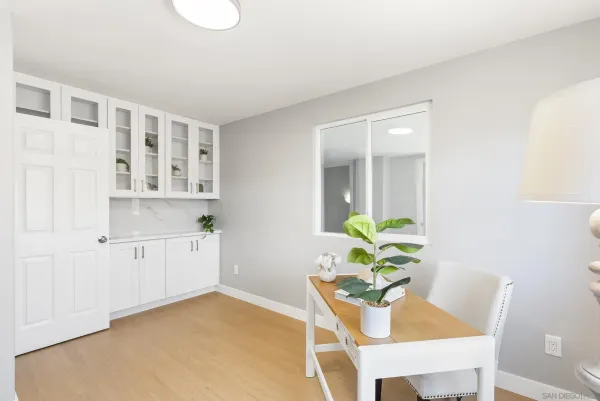 a view of kitchen with furniture and wooden floor