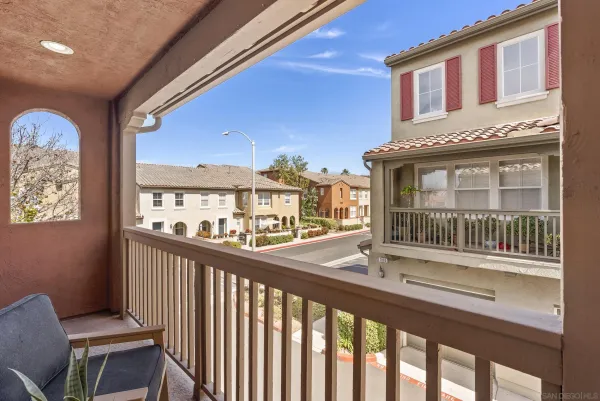 a view of a brick building from a balcony