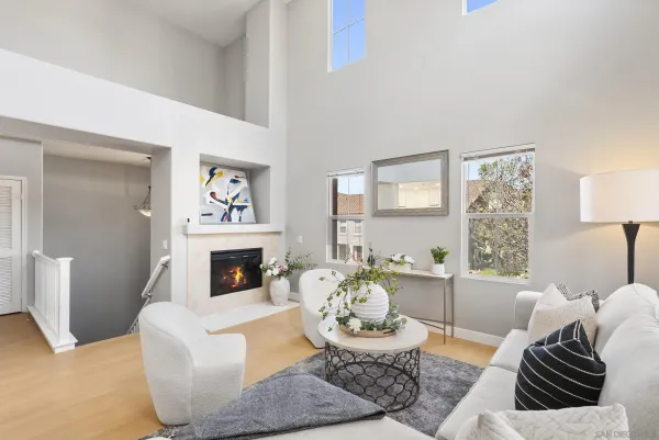 a living room with furniture and a fireplace