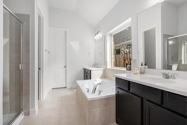 a en suite bathroom with a sink and mirror