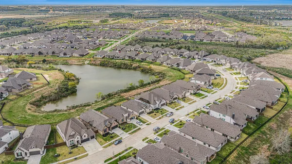 an aerial view of ocean residential house with outdoor space and river