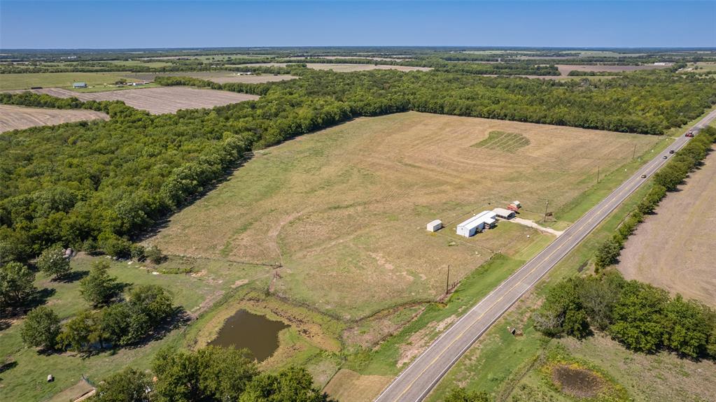 8678 FM 904 Pecan Gap, TX 75469 - Photo 1 of 1 a view of a lake with a yard
