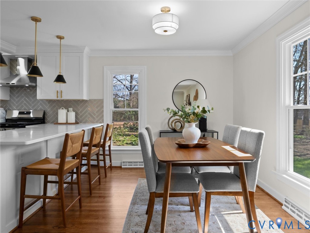 2501 Wildercroft Road Midlothian, VA 23113 - Photo 13 of 79 a view of a dining room with furniture and wooden floor