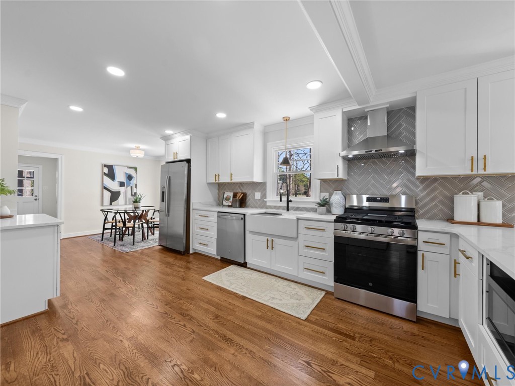 2501 Wildercroft Road Midlothian, VA 23113 - Photo 21 of 79 a large kitchen with stainless steel appliances granite countertop a stove and a sink