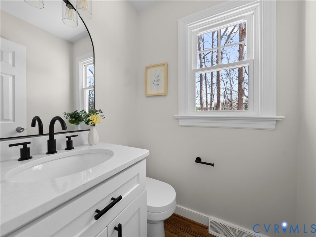 2501 Wildercroft Road Midlothian, VA 23113 - Photo 26 of 79 a bathroom with a sink a toilet and a window