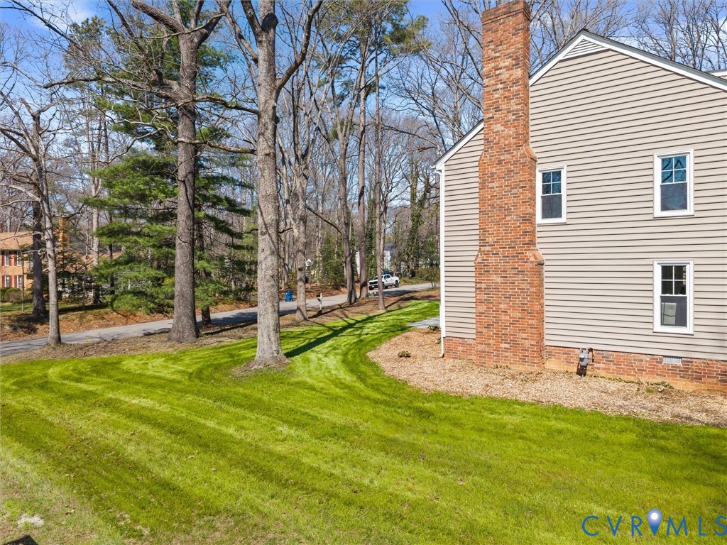 2501 Wildercroft Road Midlothian, VA 23113 - Photo 4 of 79 a view of a house with backyard and a tree