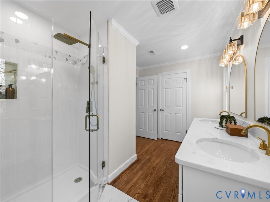 2501 Wildercroft Road Midlothian, VA 23113 - Photo 42 of 79 a bathroom with a sink and a mirror