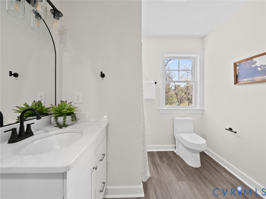 2501 Wildercroft Road Midlothian, VA 23113 - Photo 61 of 79 a bathroom with a sink a toilet and a mirror