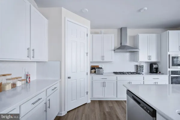 a living room with furniture a rug and a window