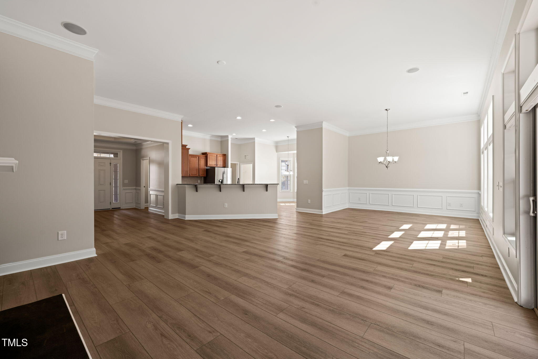 7652 Channery Way Raleigh, NC 27616 - Photo 8 of 48 a view of a kitchen with wooden floor and a kitchen