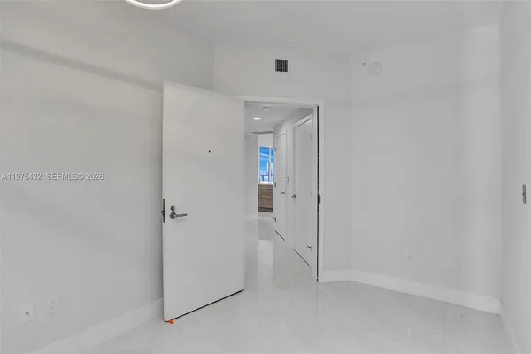 a bathroom with a granite countertop sink a toilet and bathtub