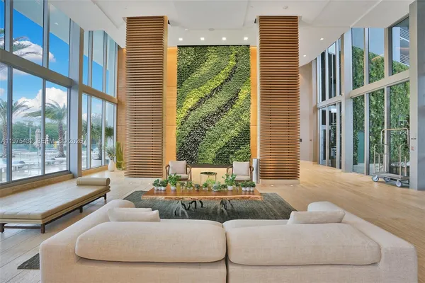 a view of livingroom with furniture and floor to ceiling window