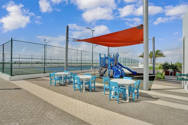 a building view with sitting space and swimming pool
