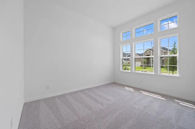a white vase with white flowers